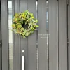 グリーン胡蝶蘭とグロリオサのハーフムーンリース 画像9